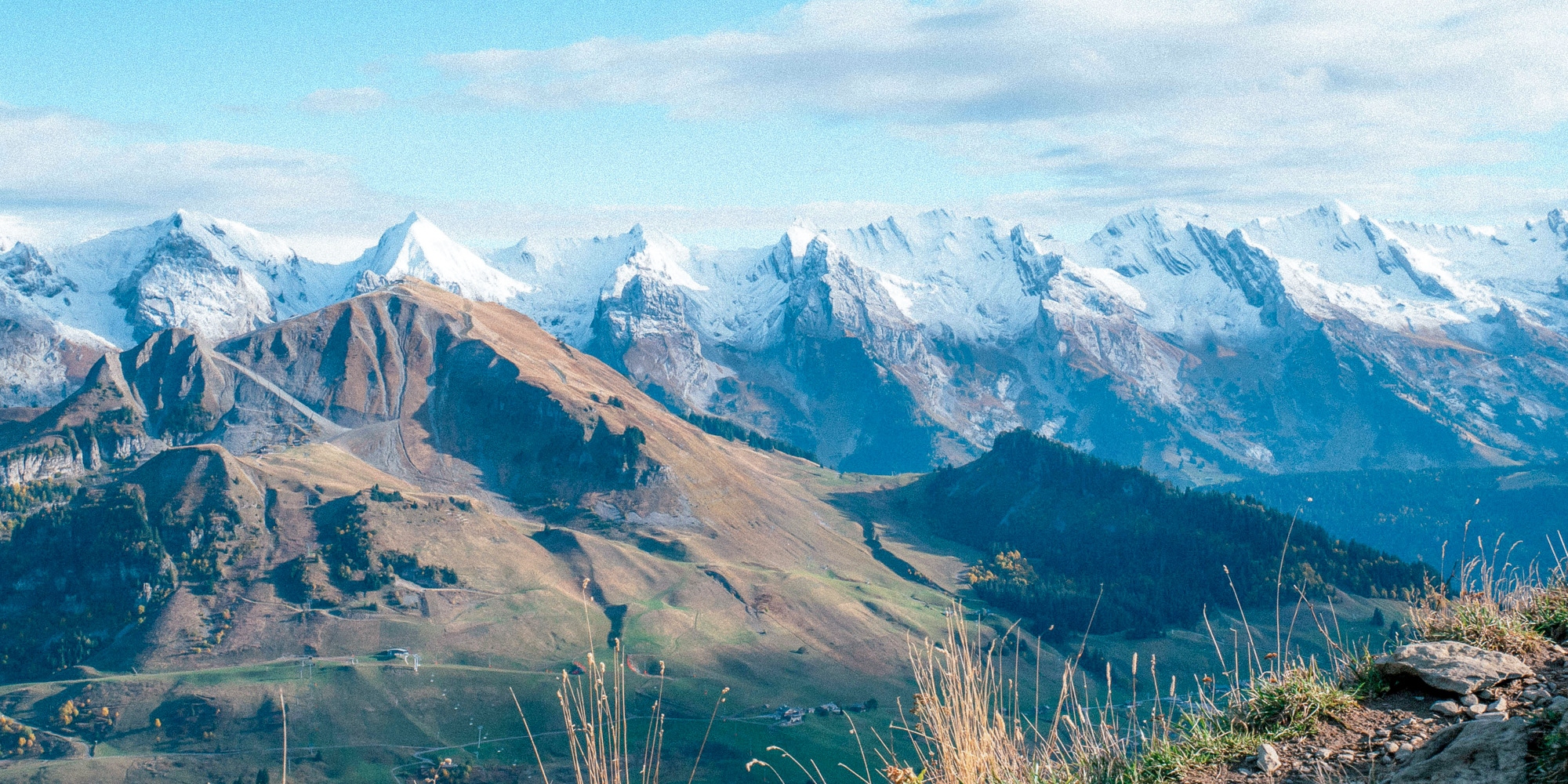 NESTLED AMIDST SNOW-CAPPED PEAKS AND VERDANT VALLEYS.
